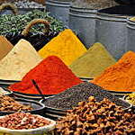 Spices for sale at market stall.