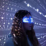 Woman wearing augmented reality glasses at night