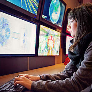 Young woman is working in a control room
