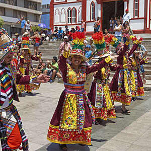 Tinkus dancers in colourful costumes performing at the annual Carnaval Andino con la Fuerza del Sol in Arica, Chile.